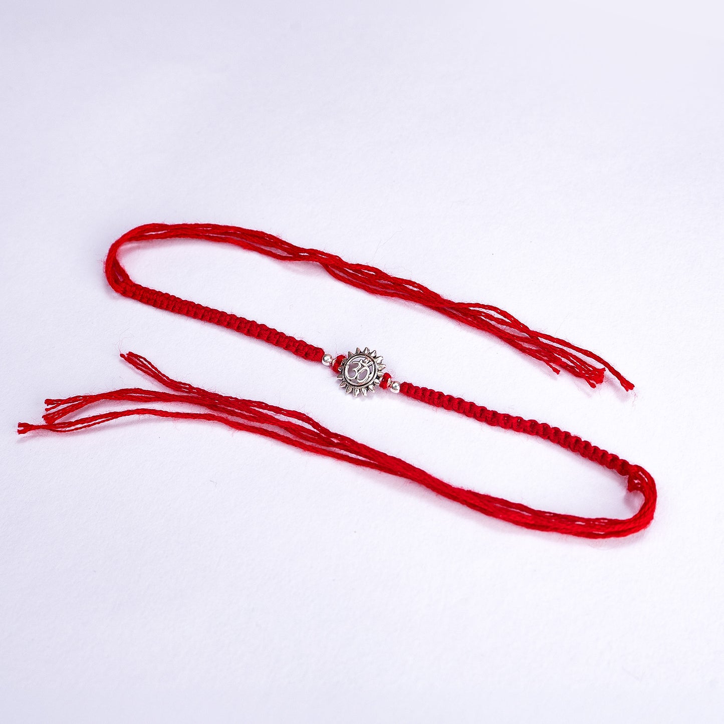 Om Sun Silver Red Thread Rakhi